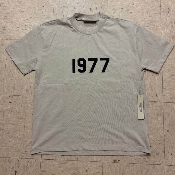 Fear of God Essentials “1977” Tee – Light Oatmeal - Picture 1 of 4